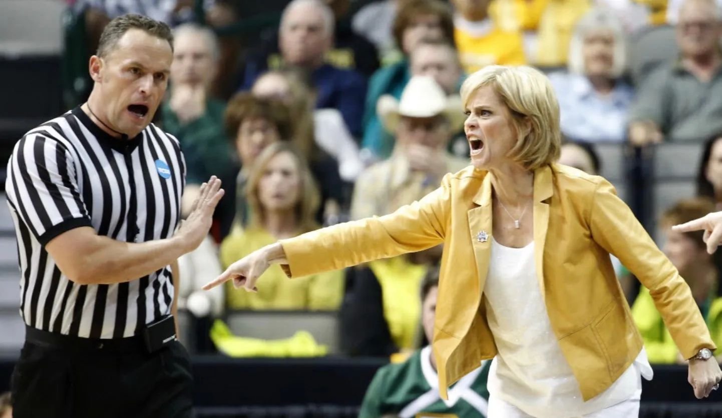 Kyle Bacon officiating a women's college basketball game