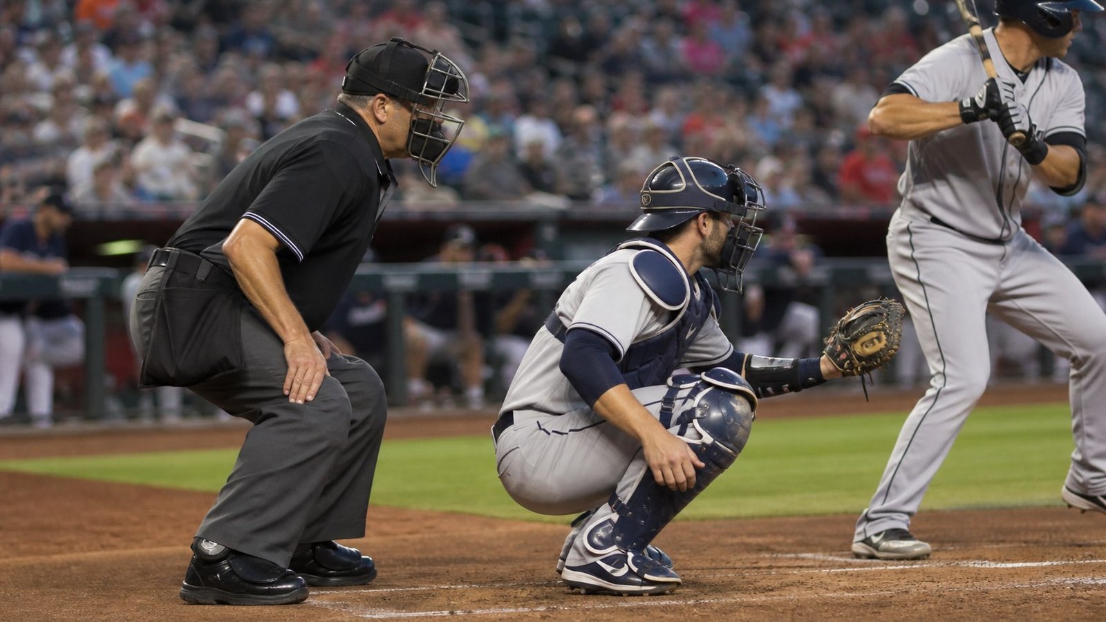 Baseball home-plate umpire tracking a live pitch